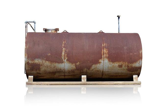 01_An_old_rusty_diesel_tank_isolated_on_a_white